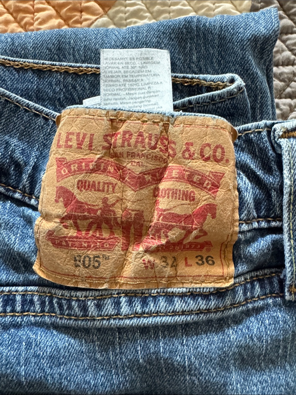 Levi's men's straight jeans in medium blue with tan patch